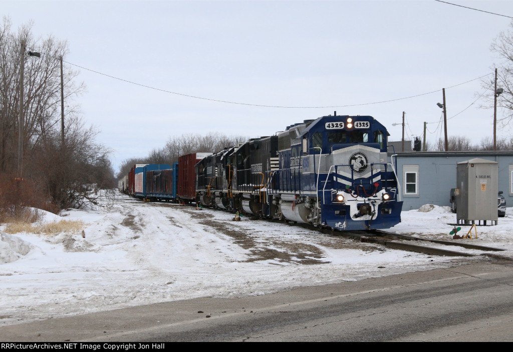 301 pauses next to the yard office as the conductor makes a cut